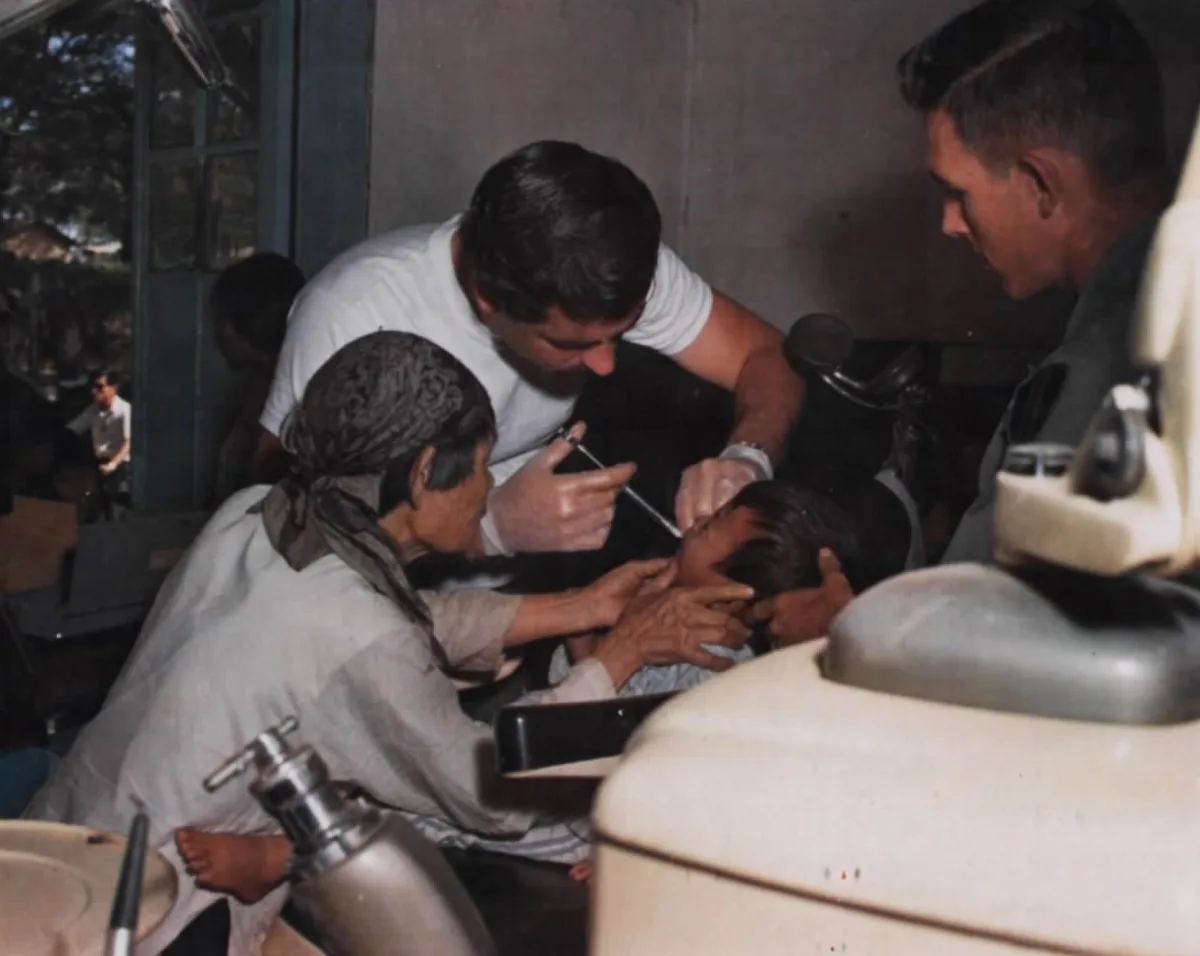 US dentist treats Vietnamese child at the Chieu Hoi Center in Pleiku